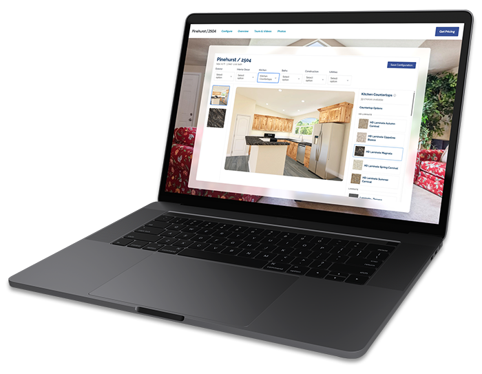 A notebook computer tilted at an angle, showing the KIT home configurator tool on the screen